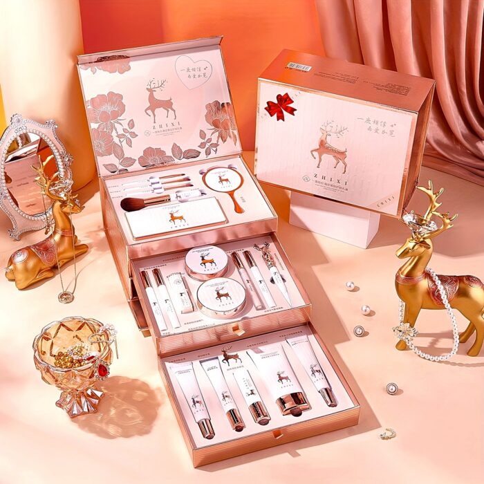 Open gift box with drawers showing the makeup, brushes and skincare items