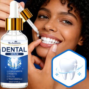 Smiling woman using the dental serum dropper