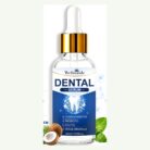 Dental serum bottle next to a coconut and mint leaves