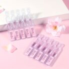 Sakura serum ampoules in their tray with cherry blossoms