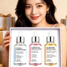 Woman holding the 3-piece face serum set in its white gift box