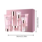 Pink 8-piece face care set in front of its gift box on a white background with box dimensions